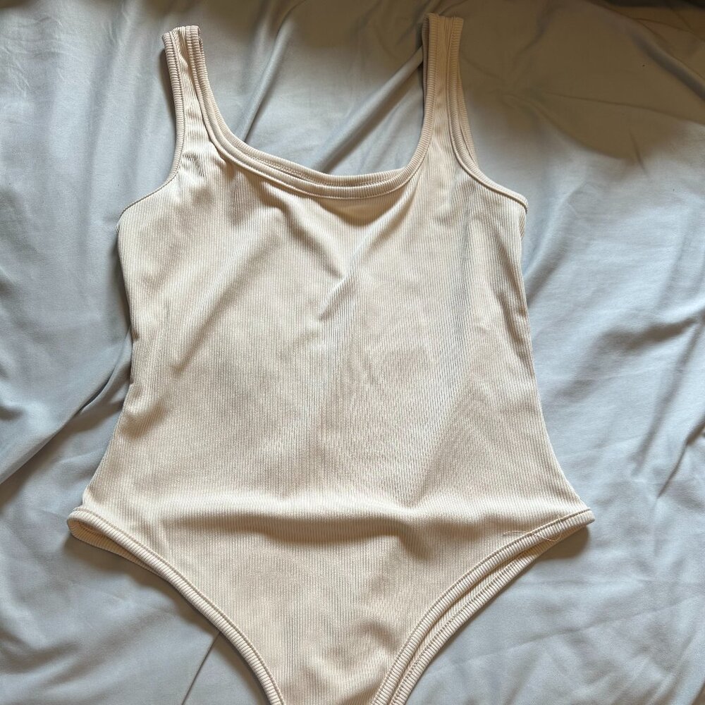 tan bodysuit small